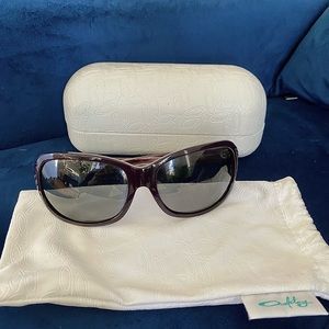 Womens Oakley Sunglasses Polarized and dark purple.